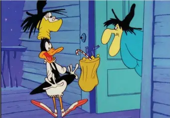  ?? ?? TRICK OR TREAT: Daffy Duck meets Witch Hazel on one of the Looney Tune cartoons airing on MeRV’s morning show ‘Toon in with Me.’