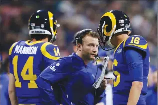 ?? Associated Press photo ?? Los Angeles Rams head coach Sean McVay speaks to Jared Goff (16) on the sideline during the second half of the NFL Super Bowl 53 football game against the New England Patriots, Sunday in Atlanta.