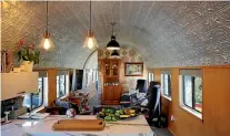  ??  ?? Stunning pressed-tin panels line the ceiling in the kitchen and lounge.