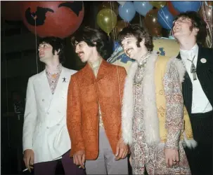  ?? The Associated Press ?? BEATLES: In this June 1967 file photo, Paul McCartney, from left, George Harrison, Ringo Starr and John Lennon of The Beatles appear backstage during a break in rehearsals for the live broadcast on the “Our World” program at EMI studios in London. Half...