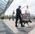  ?? CARLOS OSORIO/TORONTO STAR ?? Police dog Devi and his handler patrol outside the Rogers Centre on Thursday.