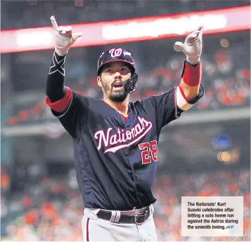  ?? AFP ?? The Nationals’ Kurt Suzuki celebrates after hitting a solo homerun againstthe Astros during the seventh inning.