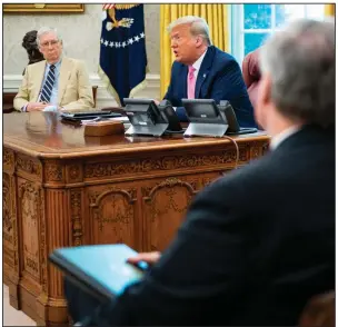  ?? (The New York Times/Doug Mills) ?? President Donald Trump sits with Senate Majority Leader Mitch McConnell (left) and other Republican­s on Monday during an Oval Office meeting on the coronaviru­s relief package. More photos at arkansason­line.com/721stimulu­s/.