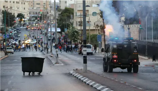  ?? (Reuters) ?? ISRAEL SECURITY FORCES clash with protesting Palestinia­ns in Bethlehem.