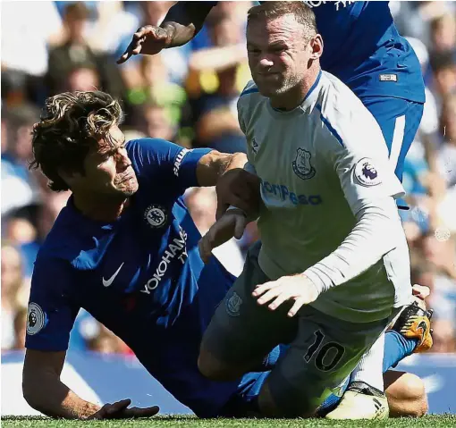  ?? — AFP ?? Left black and blue: Chelsea’s Marcos Alonso fouls Everton’s Wayne Rooney in the English Premier League match at Stamford Bridge on Aug 27. Chelsea won 2- 0.