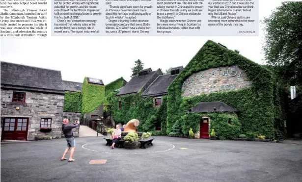  ?? PROVIDED TO CHINA DAILY ?? Tourists take photos outside the Blair Athol Distillery, one of the oldest of its kind in Scotland, which dates to 1798.
