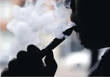  ?? NAM Y. HUH/THE ASSOCIATED PRESS ?? A national survey looks at Canadians’ attitudes toward e-cigarette use among different age groups. An Angus Reid survey says 18 per cent of Canadians have tried vaping.