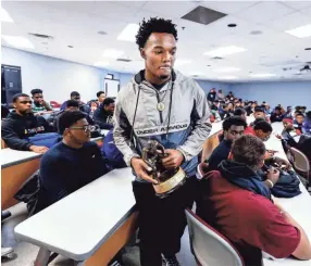  ?? MARK WEBER, THE COMMERCIAL APPEAL ?? Horn Lake’s Nakobe Dean, Mississipp­i's 6A Mr. Football winner, was announced as a The Butkus Award winner in front of his high school classmates on Wednesday afternoon.