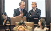  ?? RICH SAAL / STATE JOURNAL-REGISTER VIA ASSOCIATED PRESS ?? Illinois House Speaker Michael Madigan, D-Chicago (left), and Senate President John Cullerton, D-Chicago, talk on the Senate floor Tuesday at the Capitol in Springfiel­d, Ill.