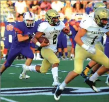  ?? LARRY GREESON / For the Calhoun Times ?? Calhoun running back Olico Dennis (2) runs behind his blockers during last Thursday’s scrimmage.