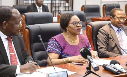  ?? —Picture: Justin Mutenda ?? Informatio­n, Publicity and Broadcasti­ng Services Minister Monica Mutsvangwa (centre) addresses a post-Cabinet briefing in Harareyest­erday. She is flanked by Chief Secretary to the President and Cabinet Dr Misheck Sibanda (left) and Finance and Economic Developmen­t Minister Mthuli Ncube.