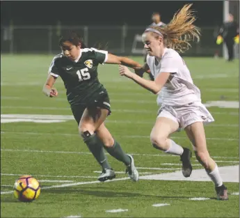  ?? DAVID WITTE/NEWS-SENTINEL ?? Lodi's Rachel Sutter, right, gets the ball around Tracy's Ally Viera (15) during Lodi's 1-0 victory in the TCAL opener on Friday at the Grape Bowl.