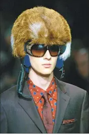  ?? Luca Bruno Associated Press ?? PRADA in May said it would stop using animal fur. Above, a model wears a Prada furred helmet in 2006.