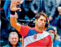  ?? — AFP ?? Serbia’s Dusan Lajovic celebrates his win over France’s Lucas Pouille on Friday.