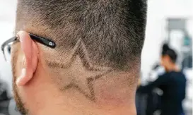  ?? Melissa Phillip photos / Houston Chronicle ?? Jose Carcamo displays the Astros logo that his wife, Diana Martinez, owner of Studio Cutz Beauty &amp; Barber, designed into his haircut.