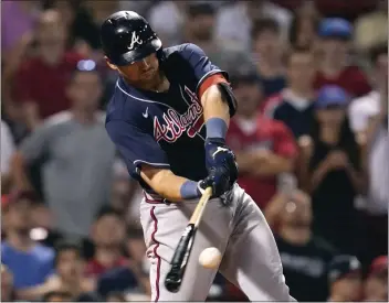  ?? CHARLES KRUPA – THE ASSOCIATED PRESS ?? MLB HIGHLIGHTS
The Braves’ Austin Riley connects on a two-run single in the 11th inning to cap a five-rbi night against the Red Sox.
