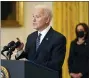  ?? ANDREW HARNIK - THE ASSOCIATED PRESS ?? President Joe Biden speaks about COVID-19 vaccinatio­ns, from the East Room of the White House, Thursday, March 18, 2021, in Washington, as Vice President Kamala Harris listens.