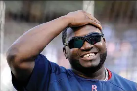  ?? BILL KOSTROUN — THE ASSOCIATED PRESS ?? David Ortiz reacts before a game against the Yankees in 2009.