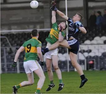  ??  ?? David Burke, St John’s, in an aerial tussle for possession in Markievicz Park.