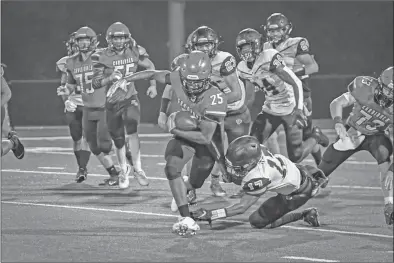  ?? GREG Davis/special to The Saline Courier ?? Harmony Grove junior KD Newton, 25, runs in a 43-0 loss to the Malvern Leopards Friday on homecoming at Sykes Stadium in Haskell. The Cardinals fall to 0-5 on the season, 0-2 in 7-4A play.