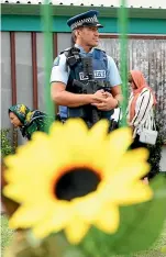  ?? GETTY IMAGES ?? A police officer stands guard outside the Hastings Mosque yesterday.