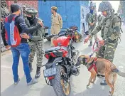  ?? PTI ?? CRPF personnel checking vehicles ahead of polling for the first phase of elections for urban local bodies in Srinagar on Saturday.