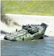  ?? THE ASSOCIATED PRESS FILES ?? Marines with the 2nd Amphibious Assault Battalion aboard AAV-7 amphibious assault vehicles. Eight marines were badly burned and seven others hospitaliz­ed after their amphibious vehicle caught on fire on Wednesday.