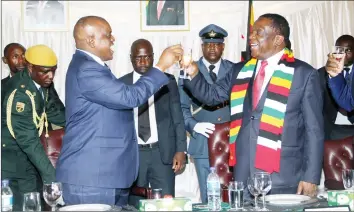  ??  ?? Presidents Mnangagwa and Masisi make a toast at a banquet at State House in Harare last night