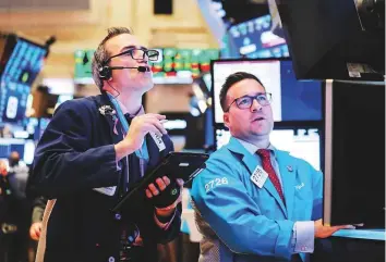  ?? Reuters ?? Traders at the New York Stock Exchange. While gridlock could hamper Trump’s political and economic agenda, few expect a reversal of tax cuts and financial deregulati­on already enacted.