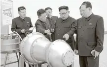  ?? Korean Central News Agency via AP ?? North Korea released a photograph on Sunday of the country’s leader, Kim Jong-un, center, inspecting what it said was a hydrogen bomb that could be fitted onto a missile.