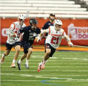  ?? PHOTOS cOuRTESy Of SyRAcuSE ATHLETicS ?? READY TO ROLL: Nick Mellen (21) is seen playing for Syracuse against Hobart, and below against Albany. Mellen was the Boston Cannons’ first-round pick (fourth overall) in the 2020 Major League Lacrosse Draft.