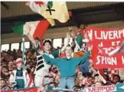  ?? Photo by Tony Hall ?? YOUNG BUFFALO: Paul Kennedy (left, standing) on Liverpool’s Spion Kop in 1994.