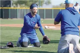  ?? JOHN ANTONOFF/SUN-TIMES PHOTOS ?? Cubs shortstop Dansby Swanson is happy with the overall performanc­e of the new uniforms, but he says the way they look needs some help.