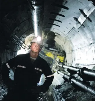  ?? GEOFF HOWE/BLOOMBERG FILES ?? Douglas McIlveen, former chief geologist at Cameco Corp.’s Cigar Lake uranium mine, surveys a mine shaft in northern Saskatchew­an. The company recently closed some operations.