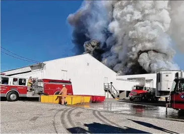  ?? Town of Montville Volunteer Fire / Contribute­d photos ?? Montville firefighte­rs battled a weekend fire at a Bozrah egg farm. More than 100,000 hens reportedly died as a result of the blaze.