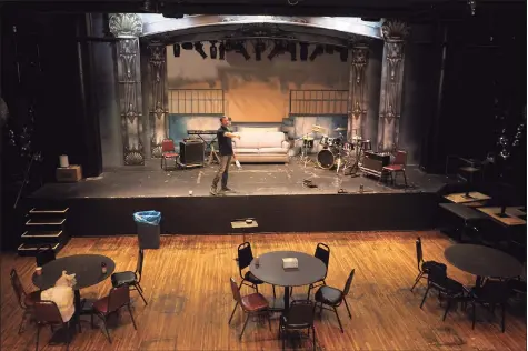  ?? Ned Gerard / Hearst Connecticu­t Media file photo ?? Director Hugh Hallinan stands on the stage of the Downtown Cabaret Theater in Bridgeport on July 23. Hallinan said Friday that he is aiming for a June reopening.