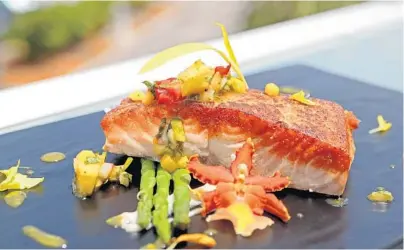  ?? JOHN MCCALL/STAFF WRITER ?? Salmon with pineapple salsa served at Bahia Mar in Fort Lauderdale. Heat oven to 400 degrees F. Sear salmon fillets in a large nonstick pan over medium high heat until lightly brown on both sides. Place salmon in a casserole dish lined with foil....