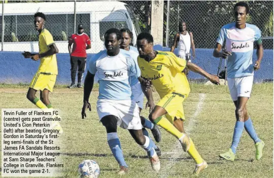  ?? ?? Tevin Fuller of Flankers FC (centre) gets past Granville United’s Cion Peterkin
(left) after beating Gregory Gordon in Saturday’s firstleg semi-finals of the St James FA Sandals Resorts Internatio­nal Major League at Sam Sharpe Teachers’ College in Granville. Flankers FC won the game 2-1.