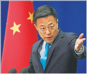  ?? (File Photo/AP/Andy Wong) ?? Chinese Foreign Ministry spokesman Zhao Lijian speaks in February 2020 during a daily briefing at the Ministry of Foreign Affairs office in Beijing. Zhao has repeatedly suggested on Twitter the coronaviru­s might have come from the U.S. Army.