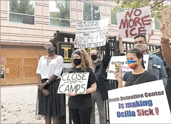  ?? JEFF AMY/AP ?? DawnWooten, left, alleged many detained women were taken to a gynecologi­st she has dubbed the “uterus collector.”