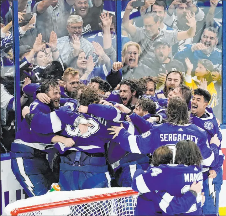  ?? Gerry Broome The Associated Press ?? The Tampa Bay Lightning enter this season seeking a third consecutiv­e Stanley Cup, which hasn’t been done since the Islanders’ dynasty of the early 1980s.