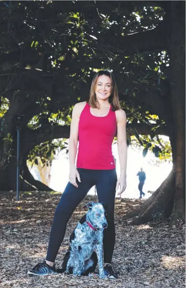  ?? Picture: JENNY EVANS ?? READY: Fitness guru Michelle Bridges at Rushcutter­s Bay Park with her dog Paddy, in preparatio­n for Personal Better Day to encourage more Aussies to ramp up their exercise.