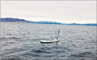  ?? OFFSHORE SENSING VIA AP ?? An autonomous Sailbuoy operated by Norwegian company Offshore Sensing performs a demonstrat­ion in the waters of Bjornafjor­den, near Bergen, Norway. The Sailbuoy completed the Microtrans­at Challenge in late August, becoming the first to complete the transatlan­tic challenge for autonomous vessels since the contest began in 2010. The Sailbuoy’s trip began in Newfoundla­nd.