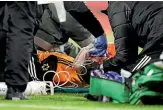  ?? AP ?? Wolverhamp­ton Wanderers’ Raul Jimenez receives treatment from medical staff.