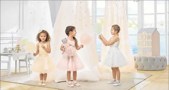  ?? Photog r aphs by Bill Holt Monique Lhuillier ?? DESIGNS by Monique Lhuillier aimed at children include canopies ($ 199), tutus ($ 69) and dolls ($ 59). Monique Lhuillier for Pottery Barn Kids launches this week.