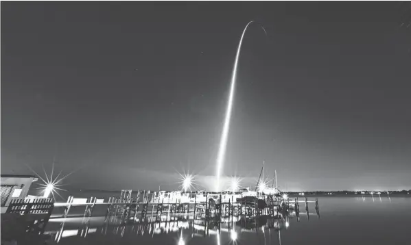  ?? MALCOLM DENEMARK/FLORIDA TODAY ?? A Spacex Falcon 9 rocket launched Thursday from Kennedy Space Center. The rocket carried an internatio­nal crew of three astronauts and a cosmonaut to the Internatio­nal Space Station.