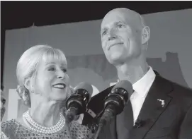  ?? WILFREDO LEE AP ?? Ann Scott, left, looks up at her husband, Florida Gov. Rick Scott, as he makes a victory speech.