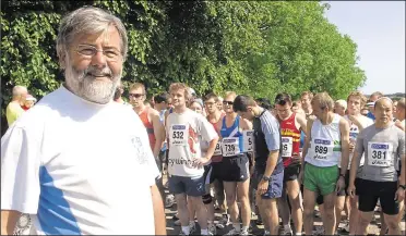  ?? ?? Mike at the start of the Canterbury half marathon in aid of the Pilgrims Hospice and, right, setting the runners off in another city event in 2009