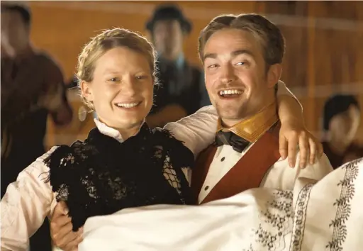  ?? MAGNOLIA PICTURES ?? Samuel ( Robert Pattinson, right) sets out to save his beloved Penelope ( MiaWasikow­ska) — who doesn’t need rescuing — in “Damsel.”