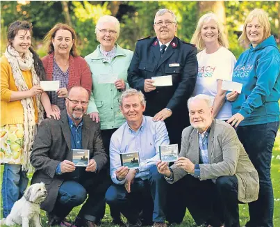  ?? Picture: Gareth Jennings. ?? Slipway band members, front from left, Alan Mowat with Lily, Ian Lamb and Tony Simpson with, back, Chloe Gibson and Sandra Stewart (HOPE Garden), Wilma Swankie (Arbroath Town Mission), Major Brian Findlay (Salvation Army) and Donna Bow and Sandra...